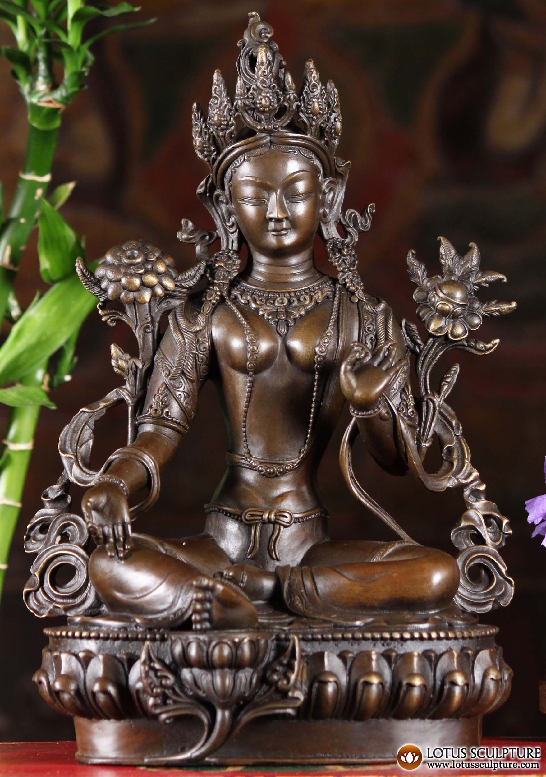 Bronze Seated Green Tara Statue Holding the Stems of a Lotus & Utpala Flower in Her Hands 12" Questions & Answers