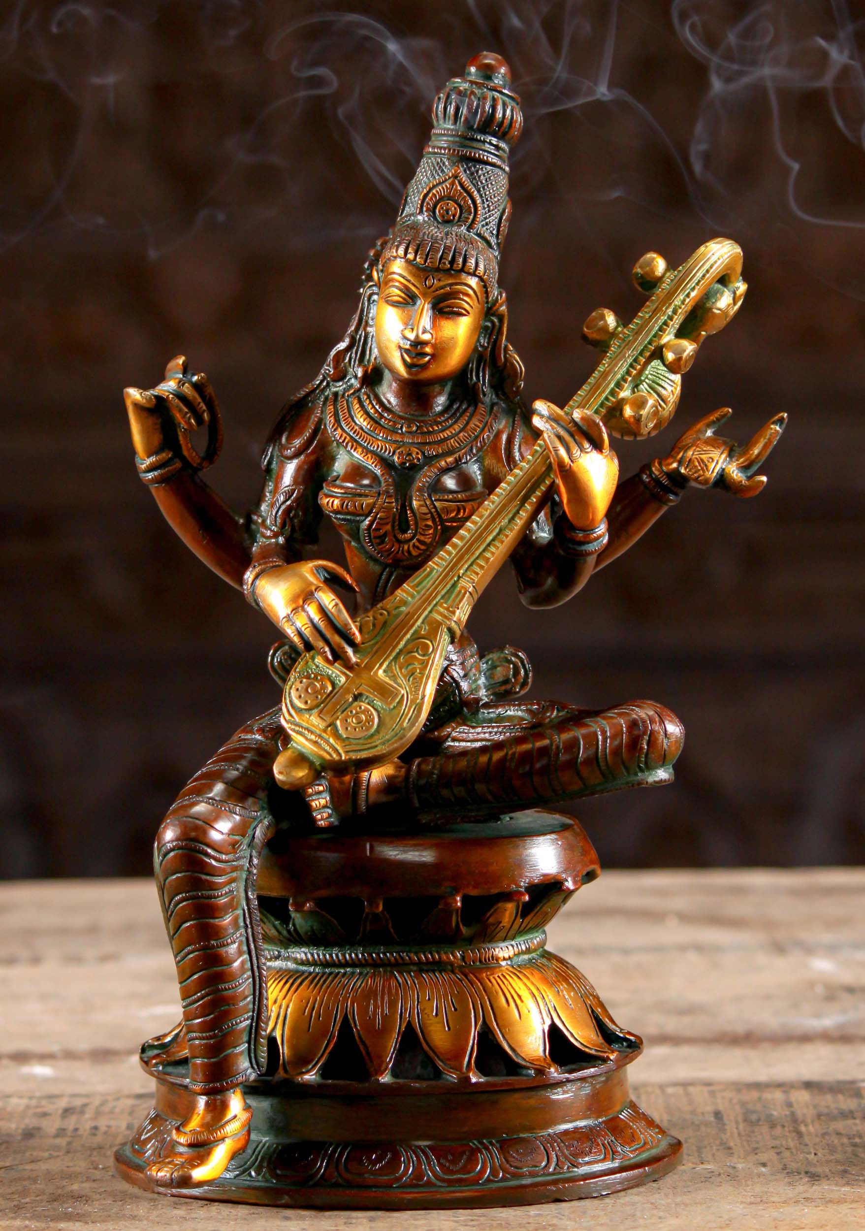 Saraswati Brass Goddess of Wisdom Statue Seated on Lotus Base Playing Veena Instrument 12" Questions & Answers