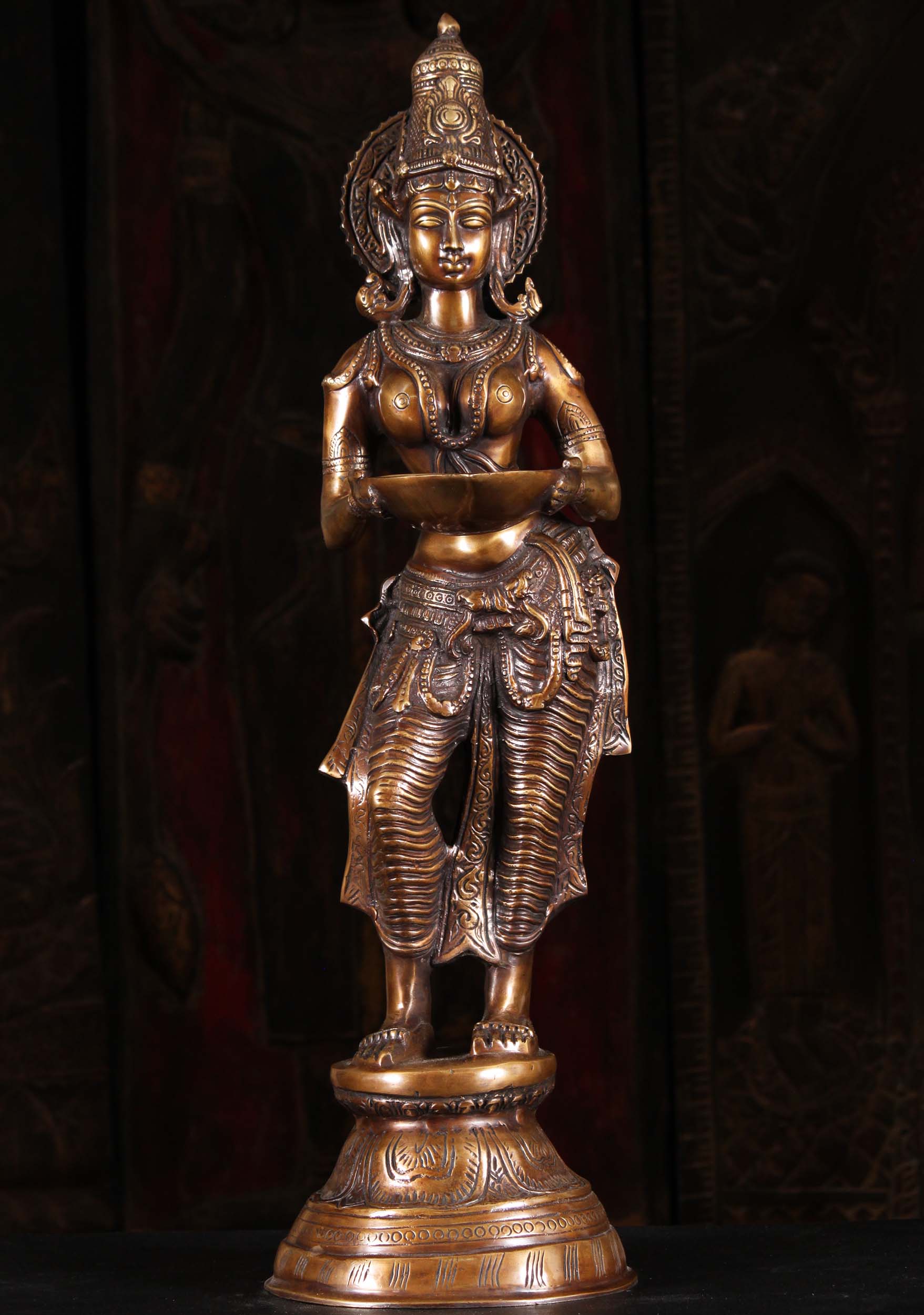 Brass Standing Statue of the Hindu Goddess of Wealth Lakshmi Holding a Deepam or Lamp 28" Questions & Answers