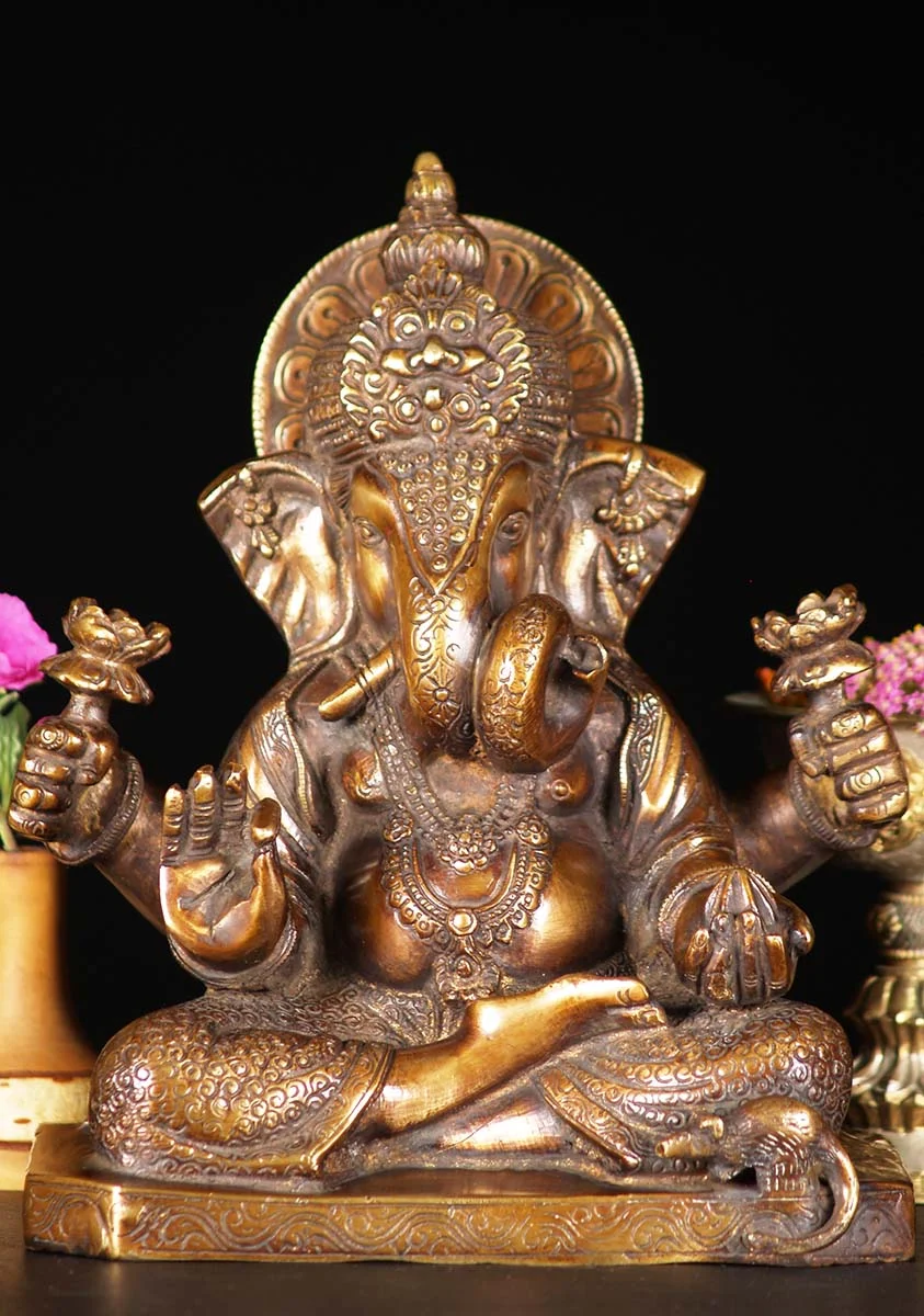 Brass Ganesh Curled Trunk & 2 Lotus Flowers Seated in Vitarka Teaching Mudra 9" Questions & Answers