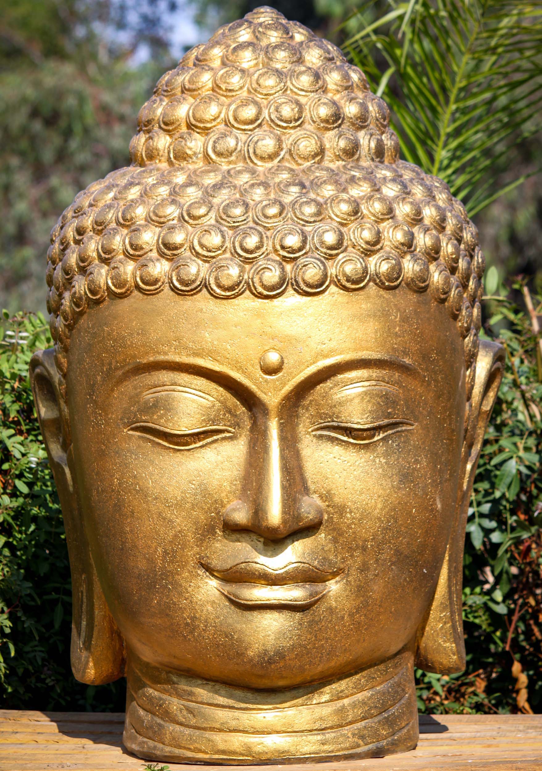 For 50” gold Buddha head statue, would shipping people place it in our backyard where we want to place it?