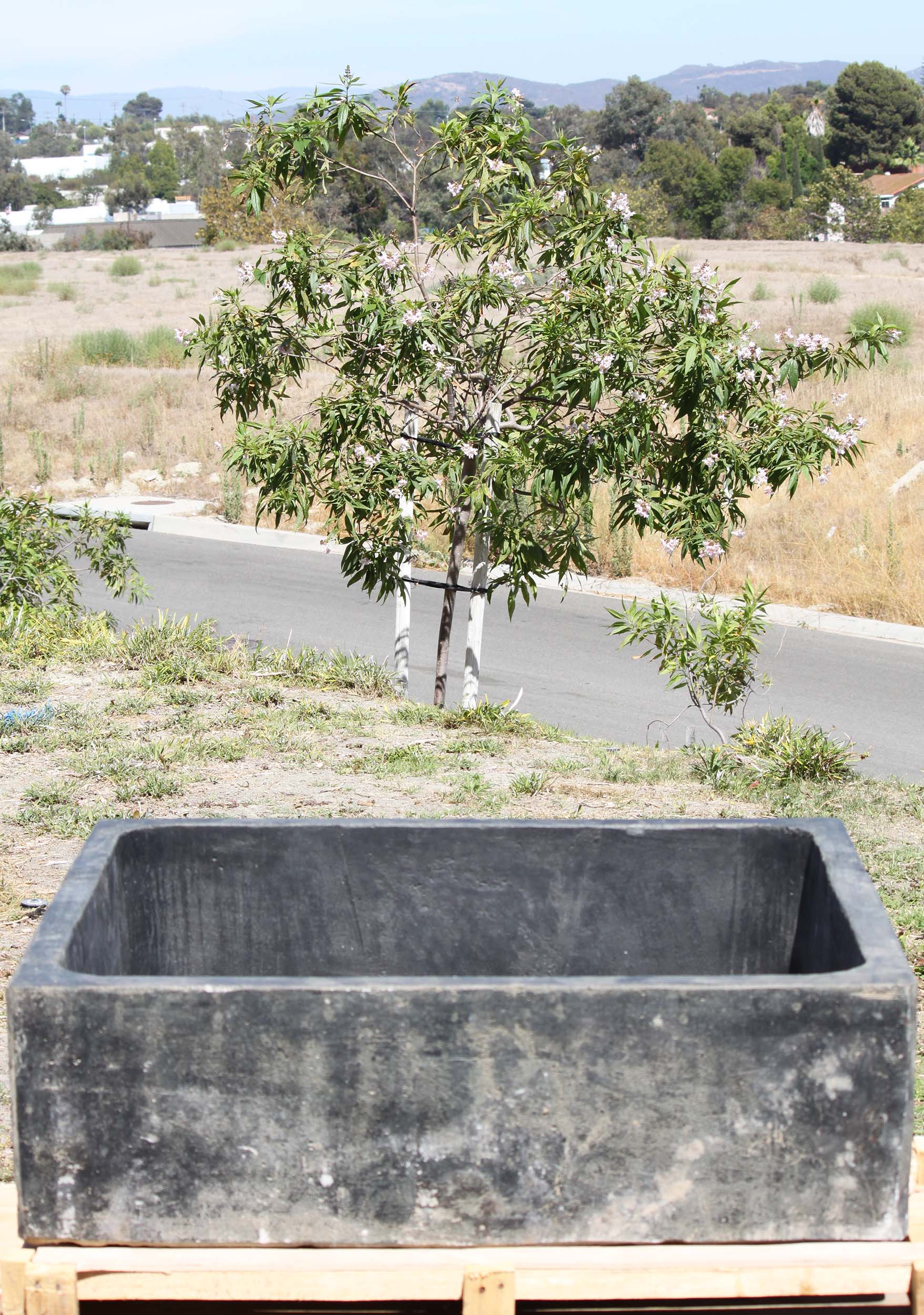 in the picture shown with the hole.  Is that for a tube that you can run to put a fountain?