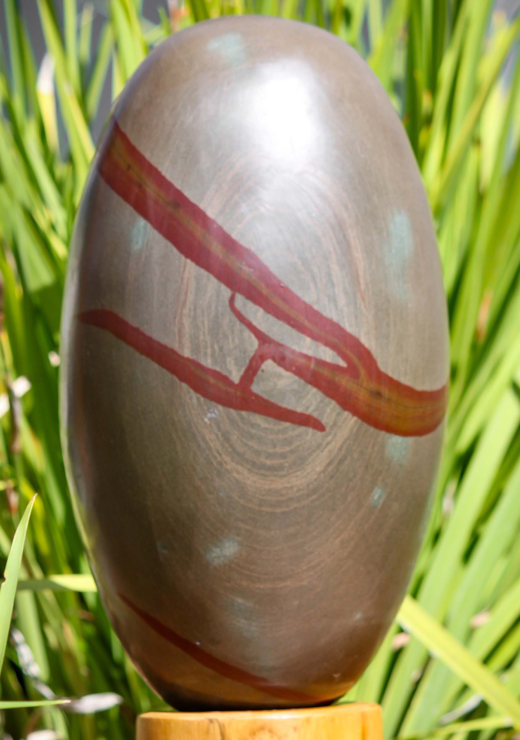 Grey Stone with Red Lines Narmada Shiva Lingam Representing Shiva as a Pillar of Fire 13.5" Questions & Answers