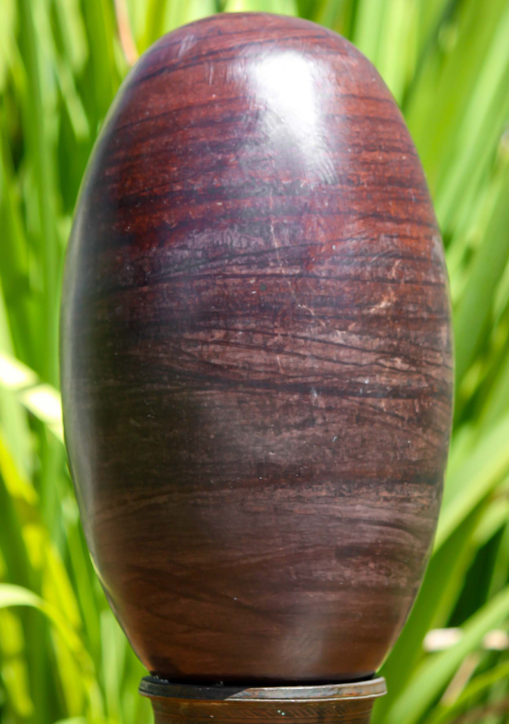 Small Deep Red and Purple Ringed Narmada Shiva Lingam Representing Shiva as a Pillar of Fire 8.5" Questions & Answers