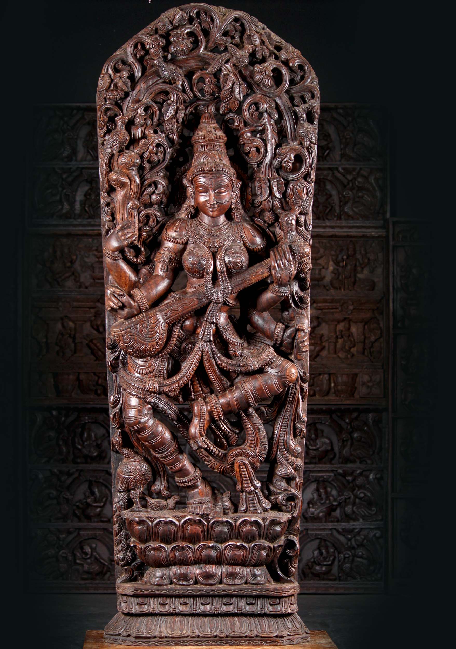 Large Wood Hindu Goddess of Wisdom Saraswati Playing Veena on Double Lotus Base under Canopy 72" Questions & Answers